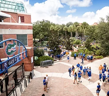 cards-visitors-gate-8 people walking outside gate 8